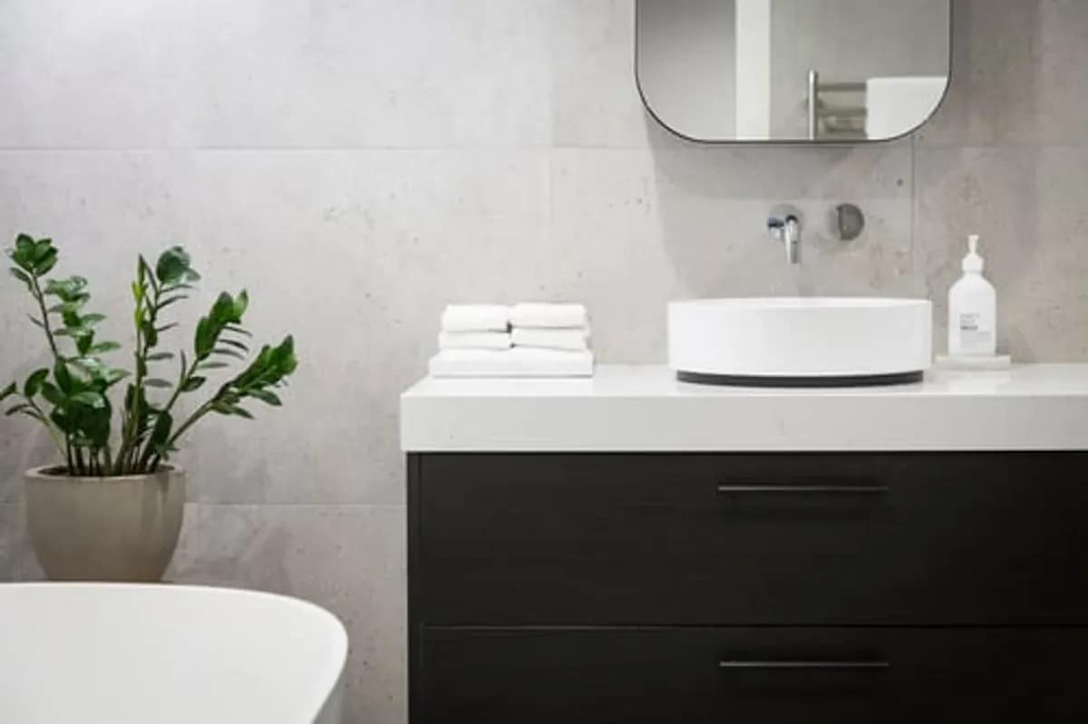 Modern remodeled bathroom with a floating vanity and vessel sink