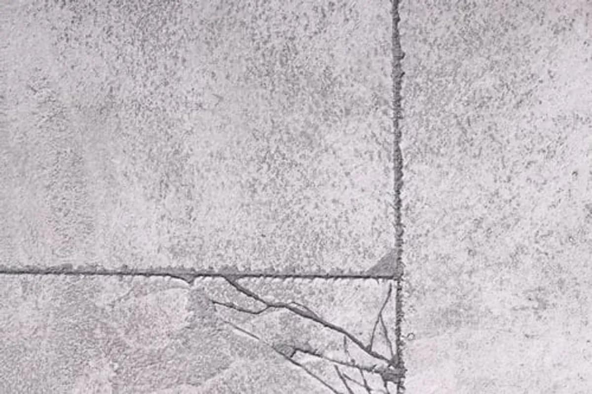 Cracked and deteriorating concrete slab surface