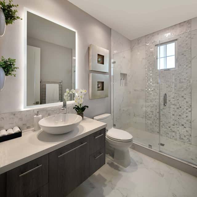Finished bathroom with a vessel sink, marble-look tile and a glass shower — Sky Property INC, Baltimore, MD
