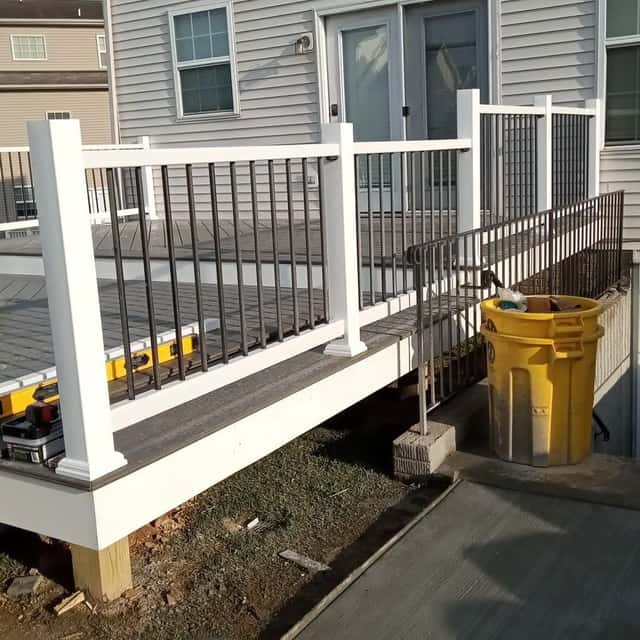 New deck framing and railing at the back of a house — Sky Property INC, Baltimore, MD