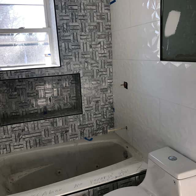 Tub surround in patterned tile before the fixtures go in — Sky Property INC, Baltimore, MD