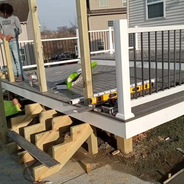Crew building a raised deck with stairs — Sky Property INC, Baltimore, MD