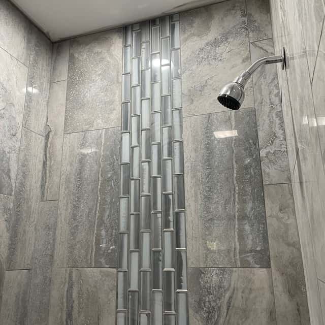 Tiled shower with a vertical mosaic accent stripe — Sky Property INC, Baltimore, MD