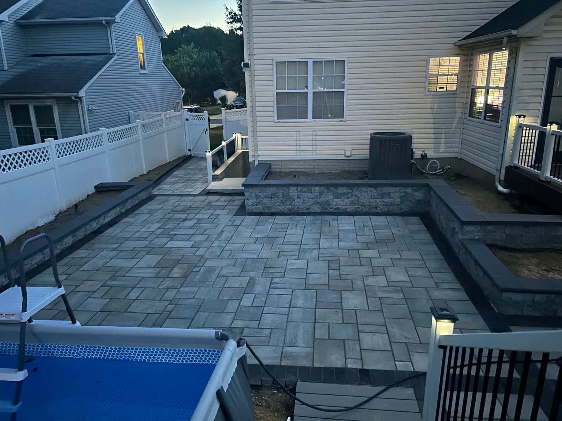 Paver patio, retaining wall and pool deck built by Sky Property INC in Baltimore, Maryland