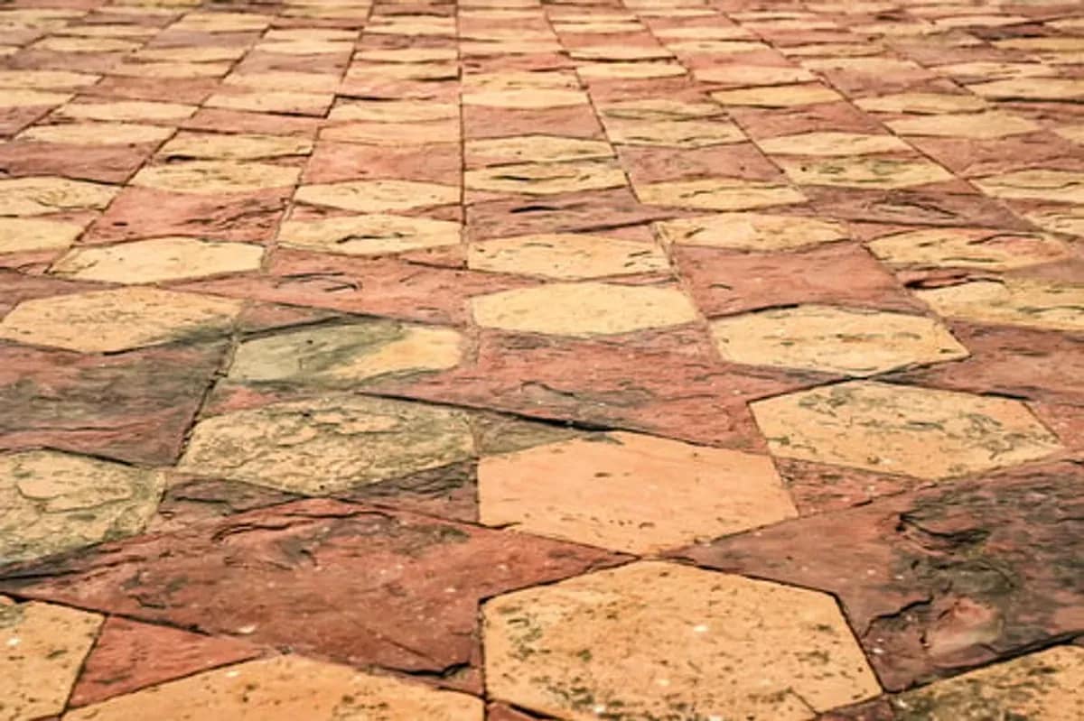 Stamped concrete patio finished in a tumbled-stone pattern